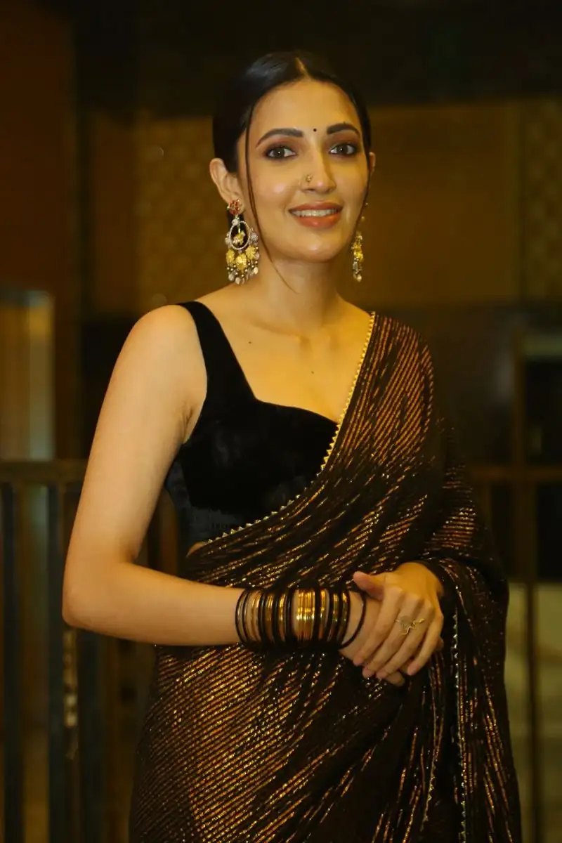 Neha Shetty in Black Saree at Movie Pre Release Event